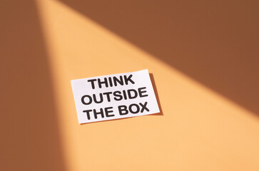 The text think outside the box . Business motivational inspirational concept