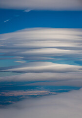 Fototapeta na wymiar Lenticular Clouds at 30,000 feet over the Oregon high desert.