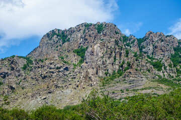 Fototapeta na wymiar Panorama of massive mountains & huge fallen stone blocks in Valley of Ghosts, near Alushta, Crimea