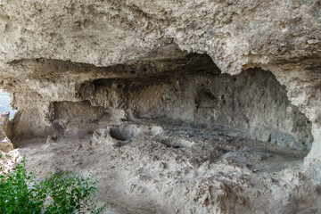 Ancient cave cell of Inkerman Cave Monastery. Monks of VIII-IX AD used natural caves to hide from pagans and live religious life quietly. They founded church that still exist. Shot in Inkerman, Crimea
