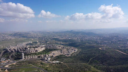 Fototapeta na wymiar Jerusalem and Betlehem city wide aerial flight view Drone high altitude view,clouds mountains, betlehem and Blue skies March 2021 Israel 