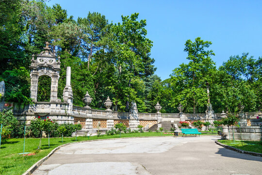 Old decorative wall in Massandra park with stone bowls, columns etc. This is part of Massandra palace complex, which was founded in 1881. Now it's popular tourist place. Shot near Yalta, Crimea