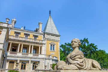 Sphinx with female head against building of Massandra palace. Complex was founded in 1881 by prince Vorotsov. Now it's popular tourist place for walking. Shot near Yalta, Crimea