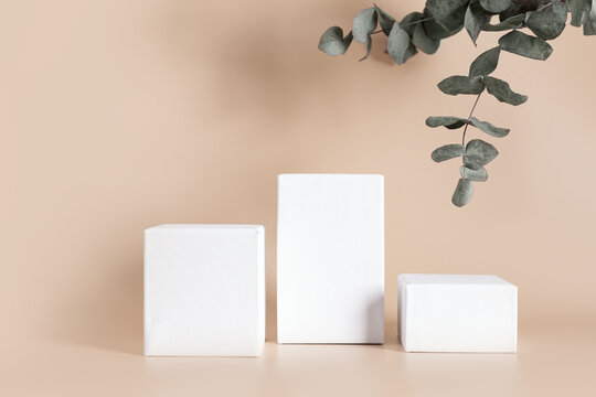 White empty podium stands on light color background.