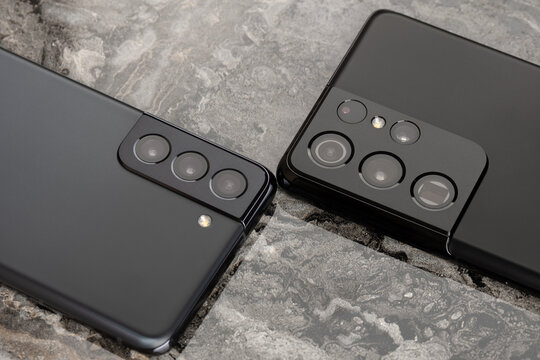 Rostov-on-Don, Russia - February 2021. Samsung Galaxy S21 and S21 Ultra 5G on a marble table.  A new smartphone from Samsung close-up.Close-up of the camera of the new Samsung smartphone.