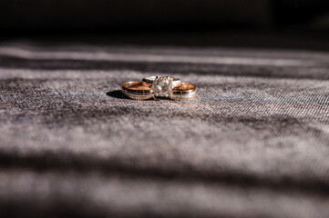 Wedding gold rings on brown background