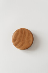 Bottom of a wooden bowl on a white background. A nice little bowl made of wood.