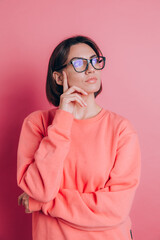 Woman wearing casual sweater on background thinking worried about a question, concerned and nervous with hand on chin