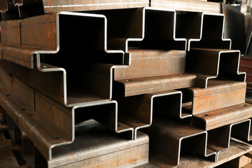 Metalworking at a factory, steel billets cut by laser and bent on a bending machine, close-up