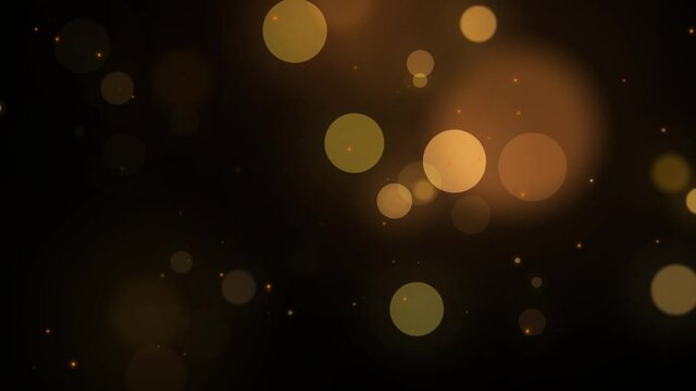 Abstract Gold blurry bokeh background with lights particles on dark background. Defocused photo effect. Slow motion animation