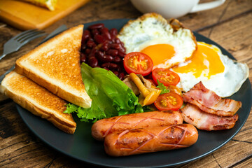 Rustical breakfast eggs, sausages, vegetables. Selective focus