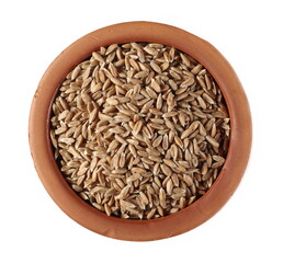 Spelt grain in clay pot isolated on white background, top view