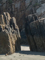 Rocks with straight edges on a beach