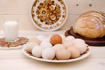 still life in a rustic style traditional farm products eggs and milk and bread