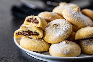 Cookies with chocolate cream. Sweet biscuits on plate.