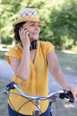 sporty and attractive senior woman talking on the mobile phone