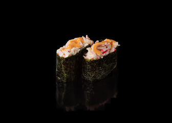 Spicy Gunkan maki sushi with crab meat, black background