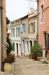 A narrow cobblestone street in a village in Provence