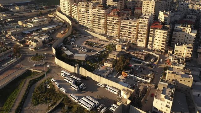 Anata Refugees Camp with security wall and idf watch tower- aerial view
Drone view from east Jerusalem, close to pisgat zeev neighbourhood, jerusalem 
