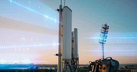 Modern antenna transmitting data at sunset