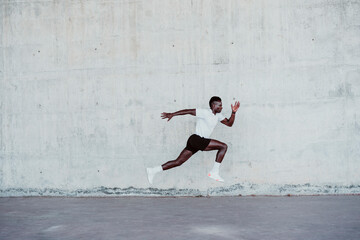 Determinant sportsman jumping by wall