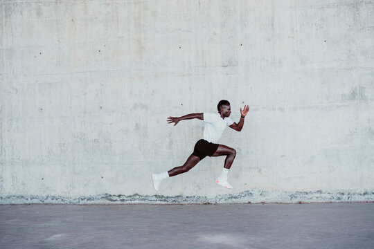Determinant sportsman jumping by wall