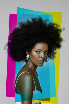 Attractive Afro woman with primary colors against white background