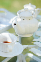 Tea drinking black tea with porcelain cups and a teapot