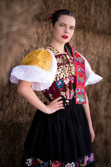 Young beautiful slovak woman in traditional dress. Slovak folklore