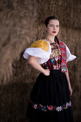 Young beautiful slovak woman in traditional dress. Slovak folklore