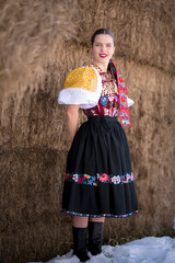 Young beautiful slovak woman in traditional dress. Slovak folklore