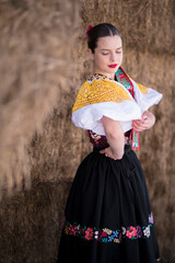 Young beautiful slovak woman in traditional dress. Slovak folklore