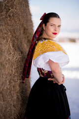 Young beautiful slovak woman in traditional dress. Slovak folklore