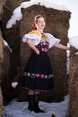Young beautiful slovak woman in traditional dress. Slovak folklore