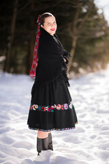 Young beautiful slovak woman in traditional dress. Slovak folklore