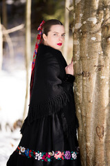 Young beautiful slovak woman in traditional dress. Slovak folklore