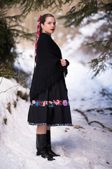 Young beautiful slovak woman in traditional dress. Slovak folklore