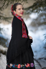 Young beautiful slovak woman in traditional dress. Slovak folklore