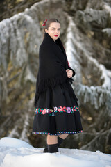 Young beautiful slovak woman in traditional dress. Slovak folklore