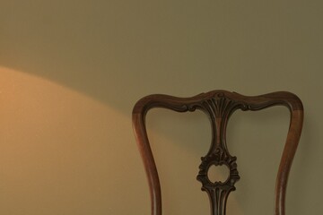 zoom in Backrest of a antique mahogany chair. 

This expensive furniture is made in England. 
dim...