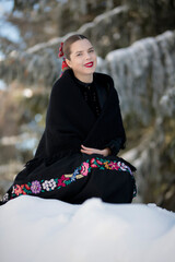 Young beautiful slovak woman in traditional dress. Slovak folklore