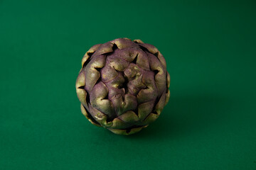 Obraz premium Fresh Artichoke on the dark green background