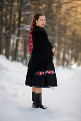 Young beautiful slovak woman in traditional dress. Slovak folklore