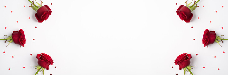 Photo overhead of roses and confetti isolated on the white background