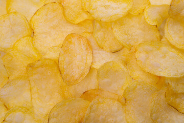 background from potato chips macro photo. potato salt chips