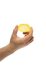 male hand holds potato chips. Chips - an appetizer that is thin slices of potatoes