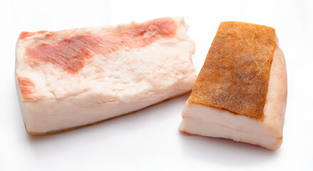raw lard two pieces on white background, pork fat