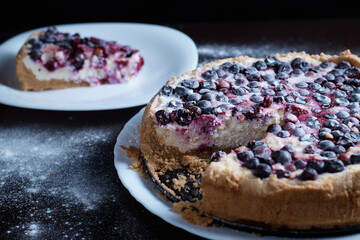 Berry pie cake from the cherries currants in a bowl of fresh steam a whole and slices of hot background blurred