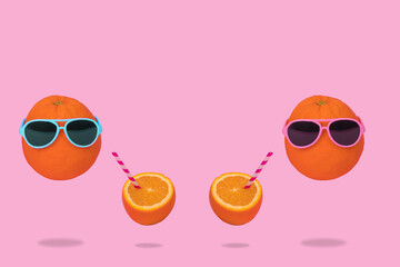Orange party of fresh fruit, hipster in sunglasses with fresh orange juice, stylish fruit.