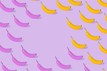 Trendy Summer pattern made with fresh banana fruit and banana colored in pink on trendy purple background.